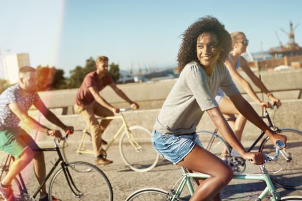 Friends going for a bike ride near Lofts at Riverwalk in Columbus, Georgia