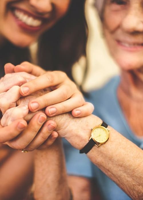 Mother and daughter enjoying a moment at our wonderful senior living community at Grand Villa of Deerfield Beach in Florida