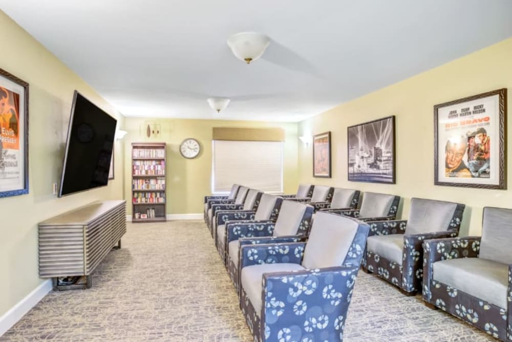 Deluxe movie theatre with movie theatre seating at Woodside Senior Living in Springfield, Oregon