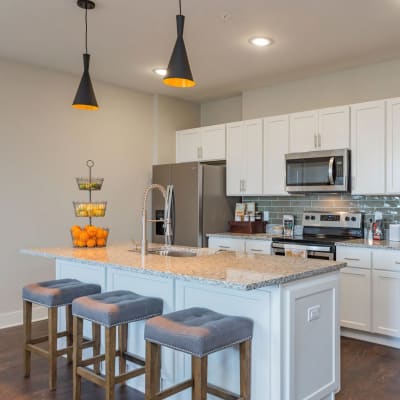 Barstool seating at the large kitchen island at Rivertop Apartments in Nashville, Tennessee