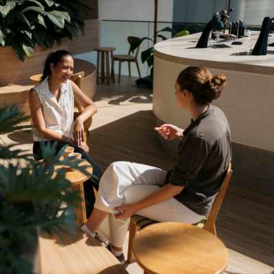 Resident talking in cafe near The Boulevard Apartment Homes in Woodland Hills, California