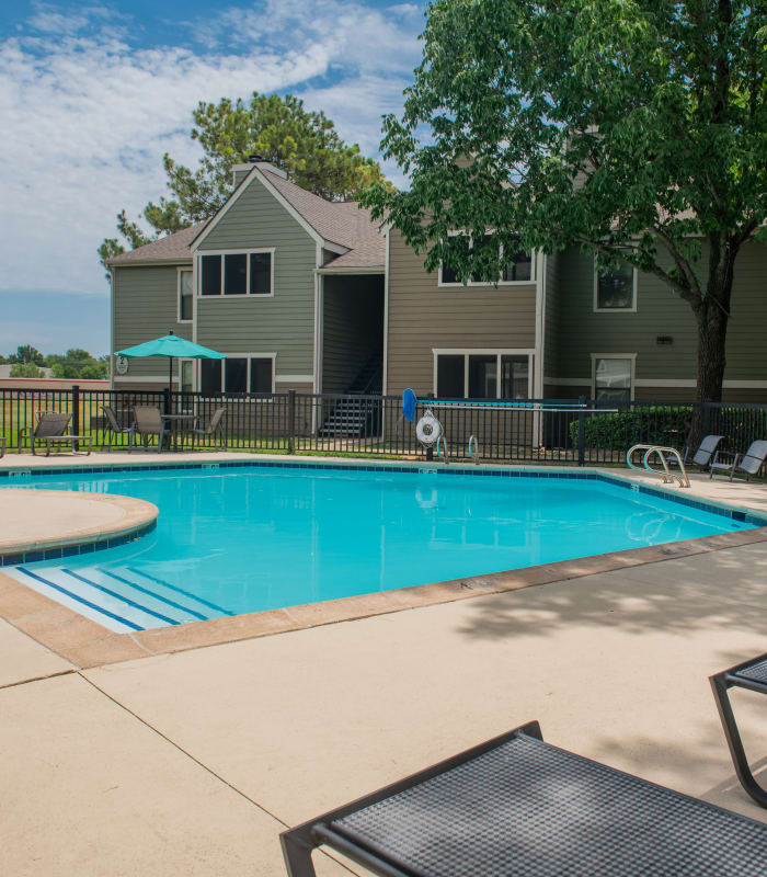 Sparkling pool and sundeck outside of Sugarberry Apartments in Tulsa, Oklahoma