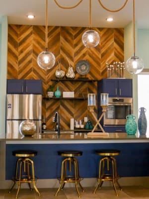 Stylish modern kitchen with counter seating in the resident lounge at Biltmore at the Park in Pflugerville, Texas
