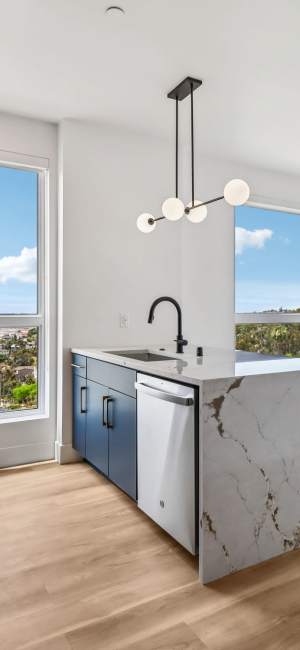 Modern kitchen with solid countertops at Treehouse in San Diego, California