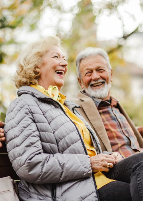 Two residents sitting outside together at Liberty Arms Assisted Living in Youngstown, Ohio