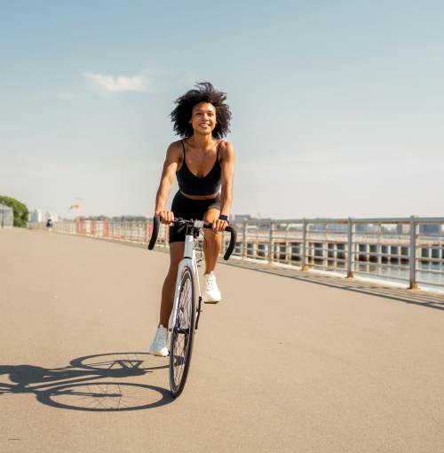 Women cycling near Flora + Fauna in San Diego, California