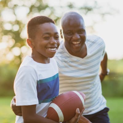 Resident and son playing at park near North Severn Village in Annapolis, Maryland