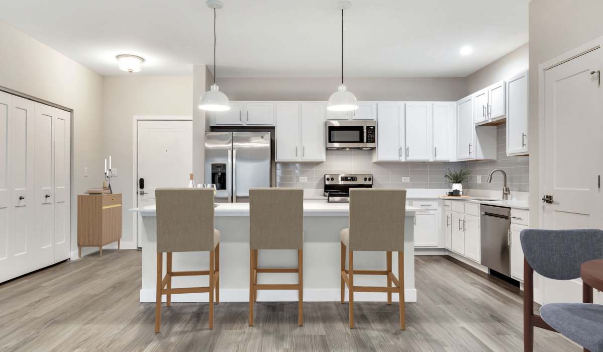 Gourmet kitchen with custom cabinetry and quartz countertops at Willow Glen in Willow Springs, Illinois