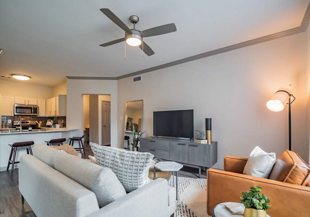 Stylish living room with neutral color palette at Creekside At Legacy in Plano, Texas