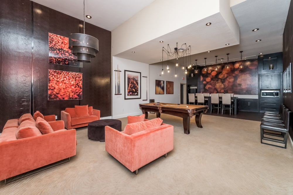 Resident clubhouse lounge and pool table at Tuscany Pointe at Tampa Apartment Homes in Tampa, Florida