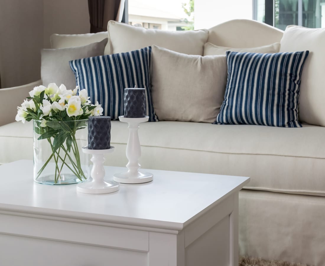 A couch and coffee table in a home at Forest Edge Townhomes in Raleigh, North Carolina