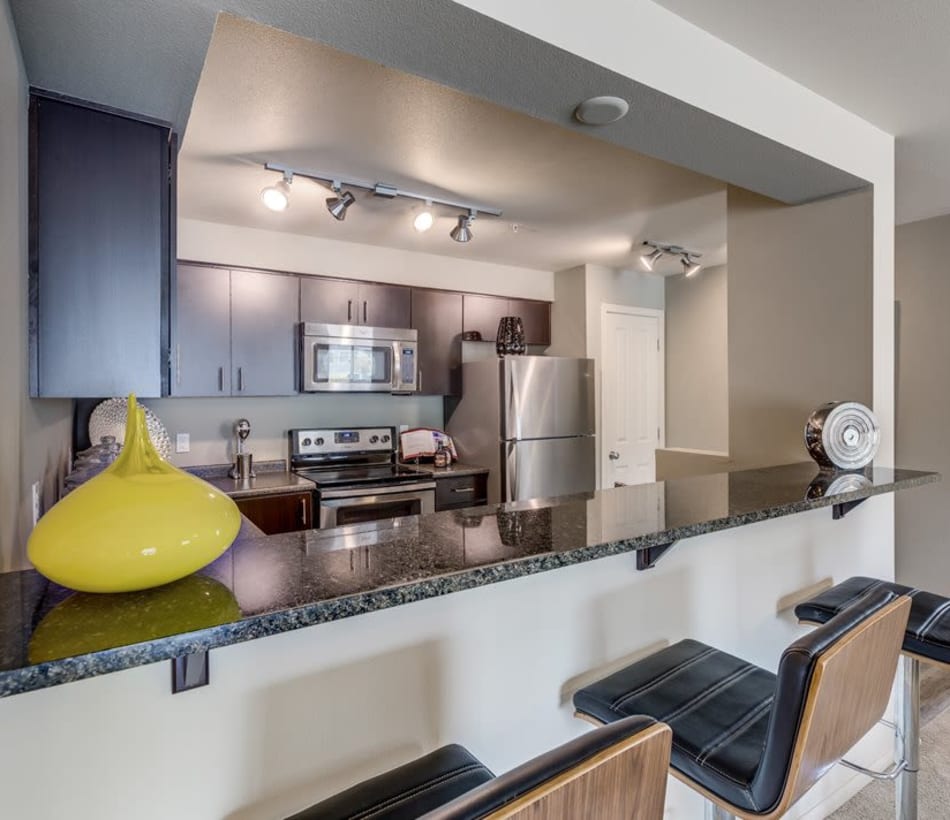 Spacious kitchen with a breakfast bar in a model home at Vue Issaquah in Issaquah, Washington
