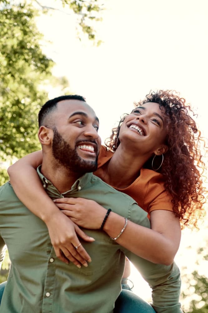 Resident couple enjoying a walk near Sail Bay Apartments in San Diego, California