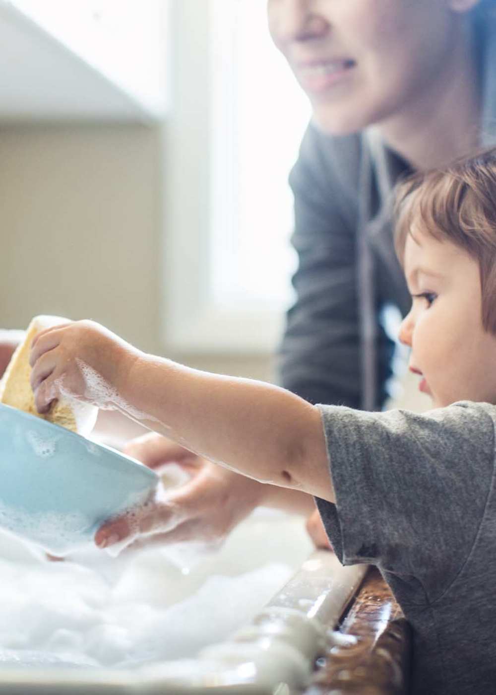Charming family moments in a cozy kitchen setting at Loop Commons in Lafayette, Louisiana.