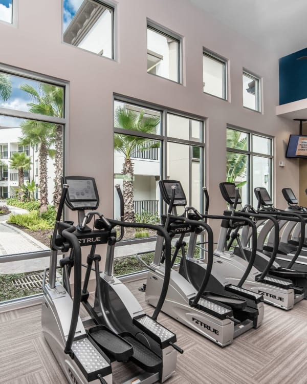 Resident doing some stretching in the yoga studio at Amelia Westshore in Tampa, Florida
