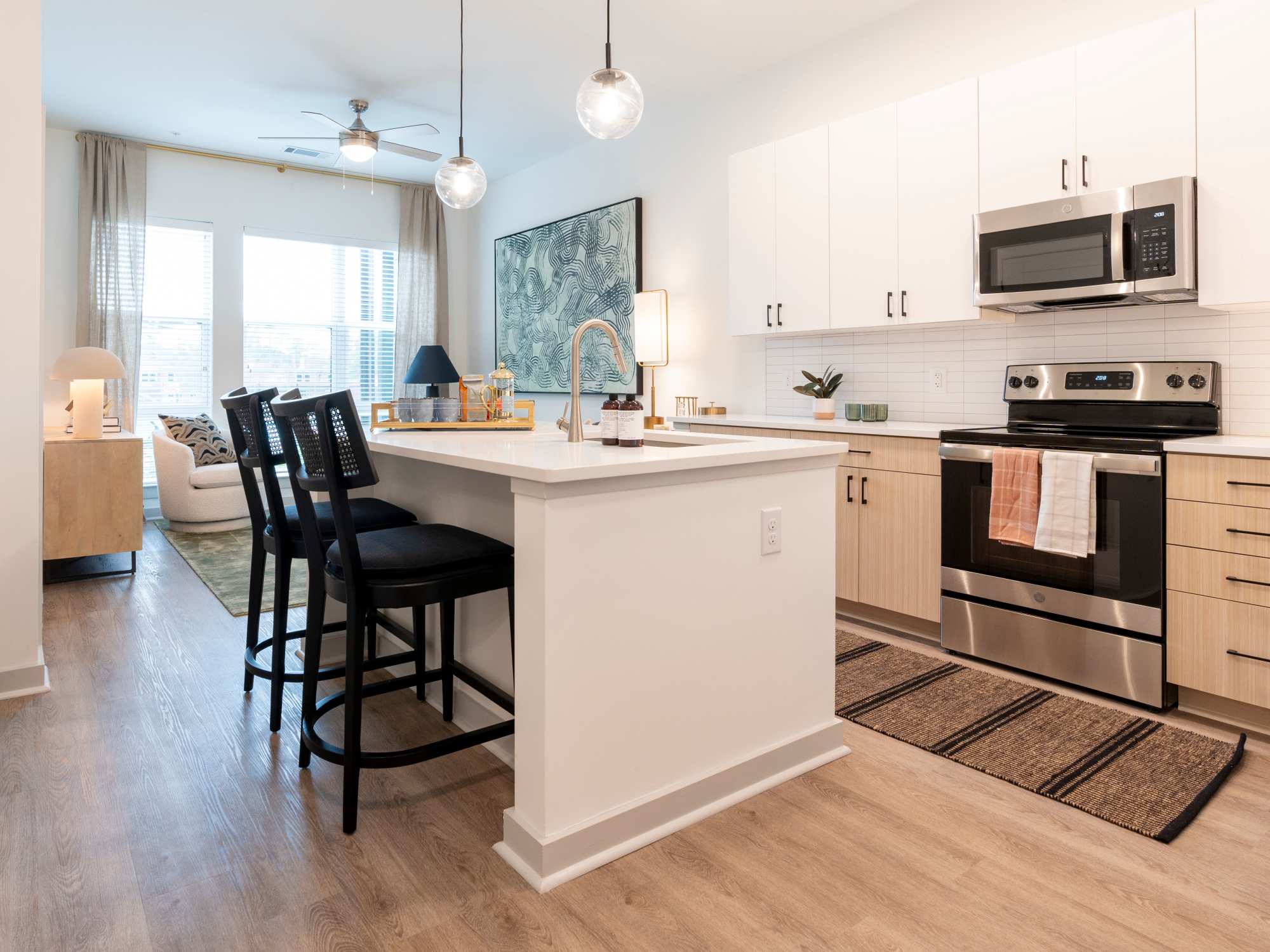 Kitchen with range and dining table at Terrazzo in Durham, North Carolina