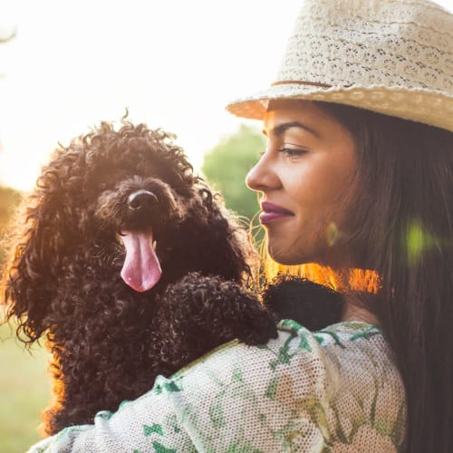 A dog and woman at The Towne at Northgate Apartments in Colorado Springs, Colorado