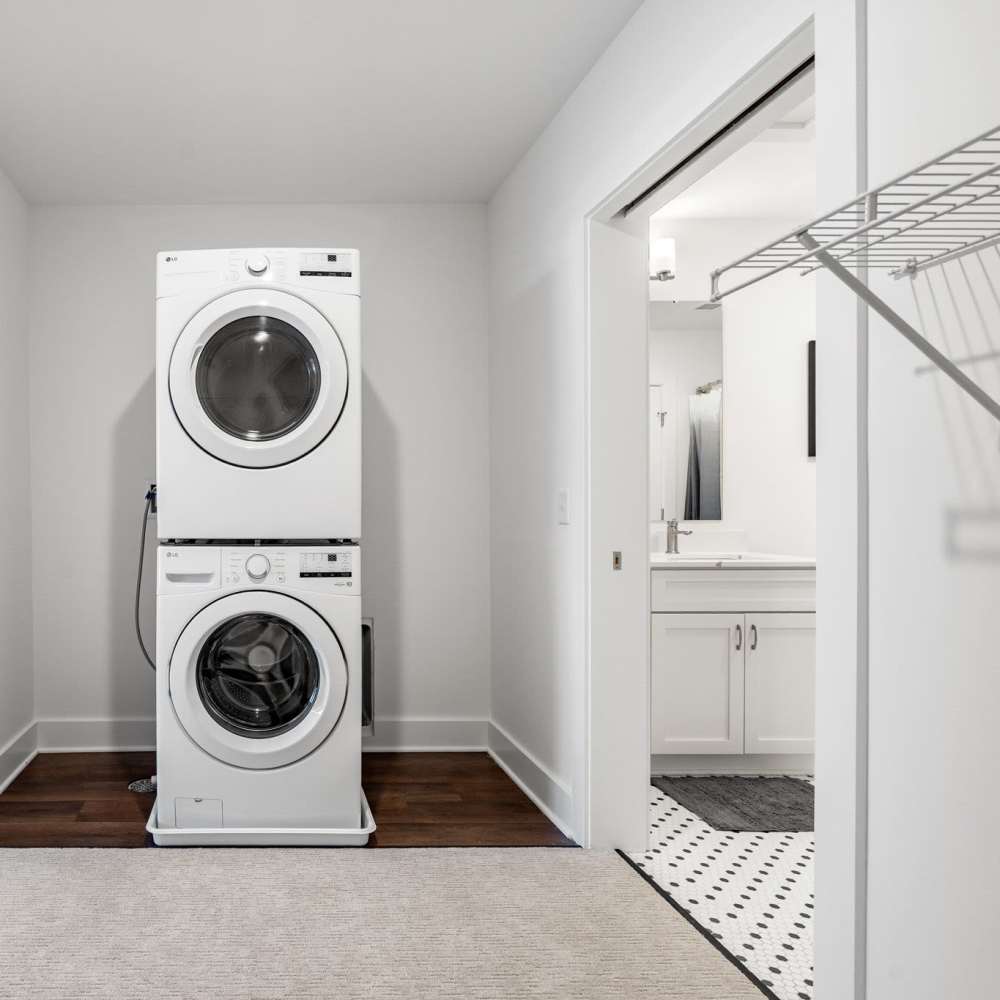 In home laundry with closet at Henrietta Place in Rochester. NY