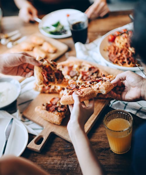 Residents enjoying some pizza near Silvermine in Victoria, Texas