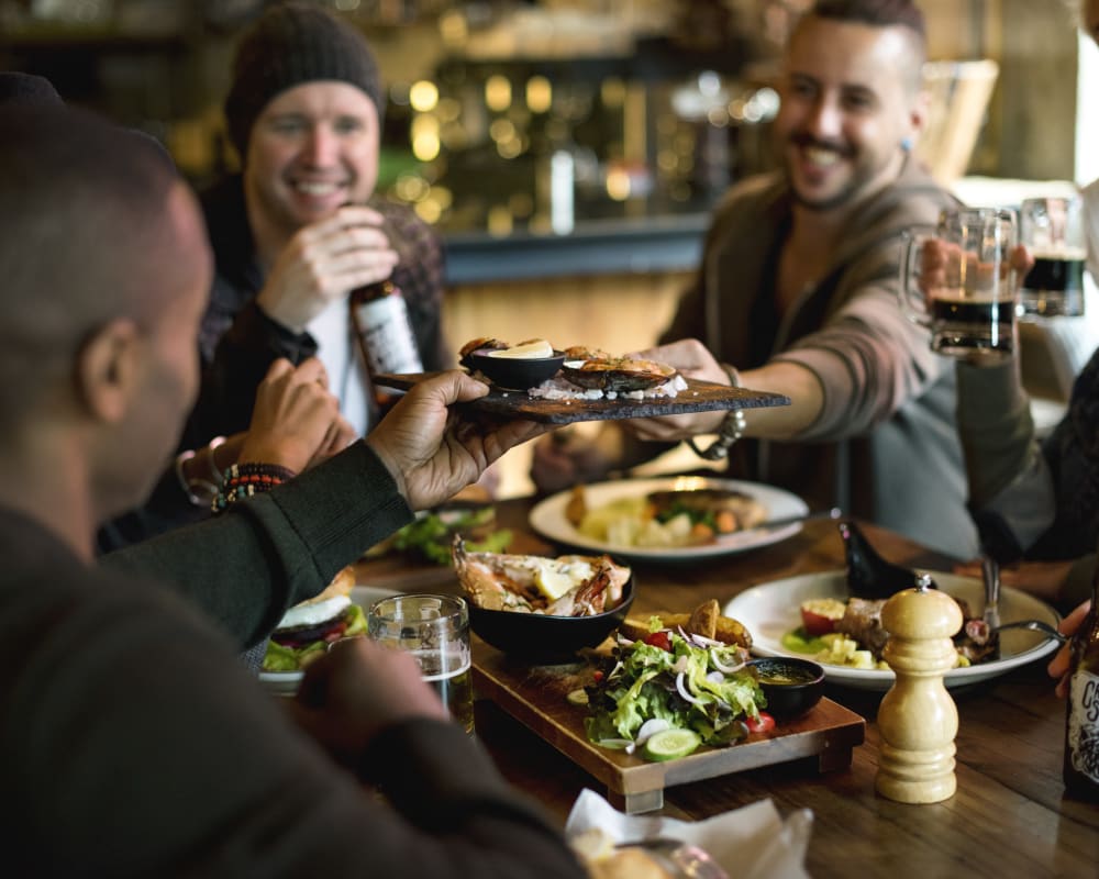 Resident friends raising a toast to the good life at Velō in Boston, Massachusetts