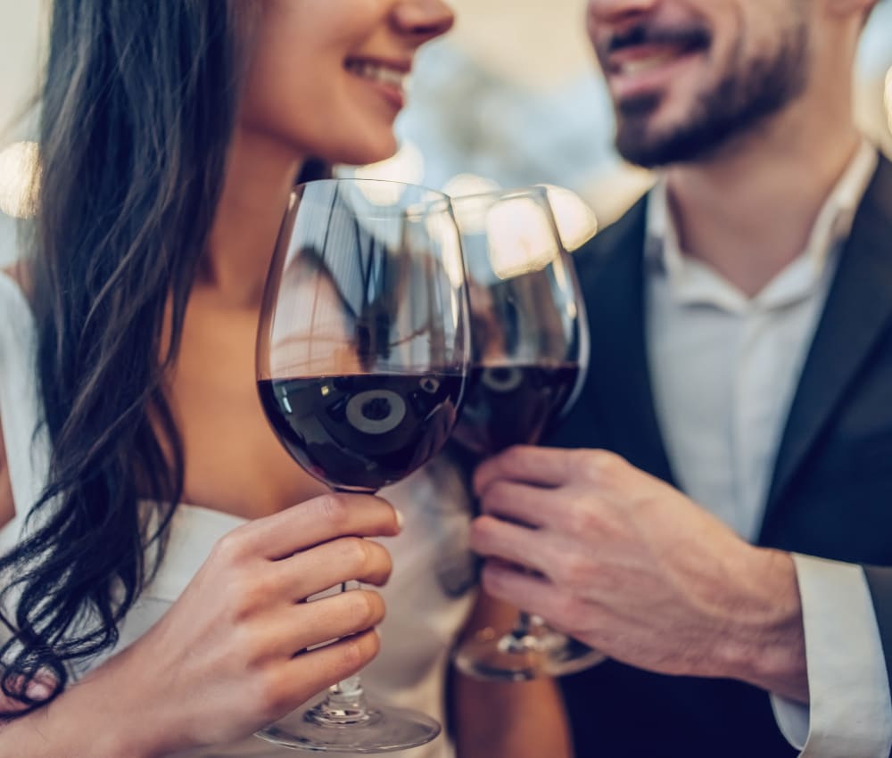 Resident couple out for a meal and some fine wine on date night near Harbor Point Apartments in Mill Valley, California