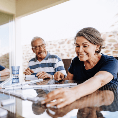 Two residents playing a tile game at Milestone Retirement Communities in Vancouver, Washington