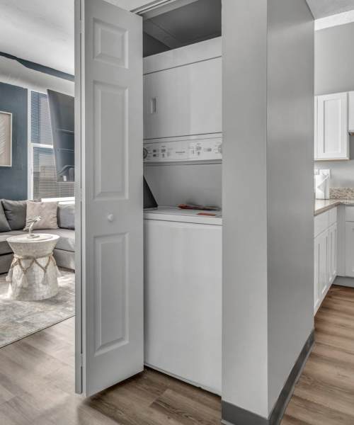 Washer and dryer in modern laundry closet at Huron Square and The Osborn in Cleveland, Ohio
