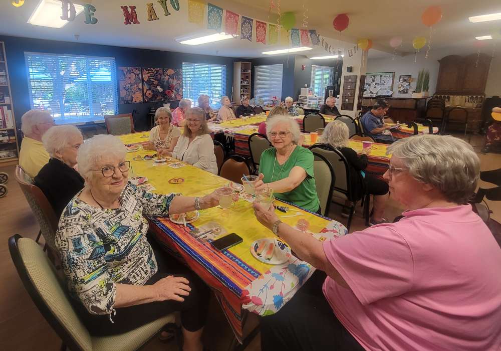 Residents enjoying drinks together at Truewood by Merrill, Roseville in Roseville, California