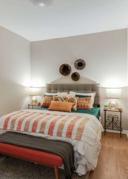 Bedroom with wood-style flooring at The Maynard at Elaine Place in Chicago, Illinois