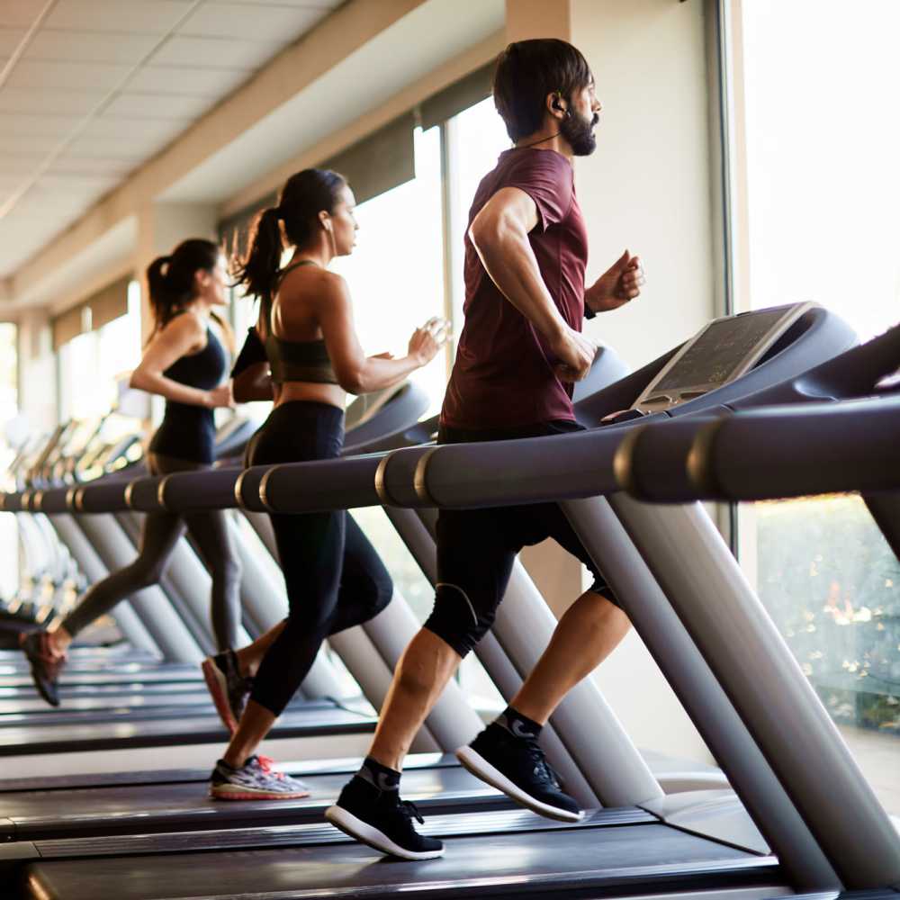 Residents working out in the fitness center at Wellshire Apartments in Denver, Colorado