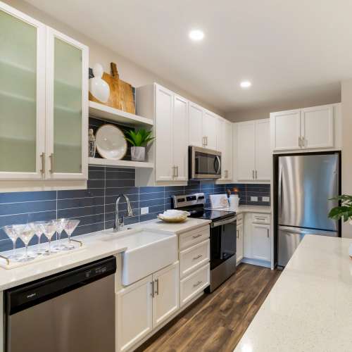 Kitchen with stainless-steel appliances at The Calvert in Charlotte, North Carolina