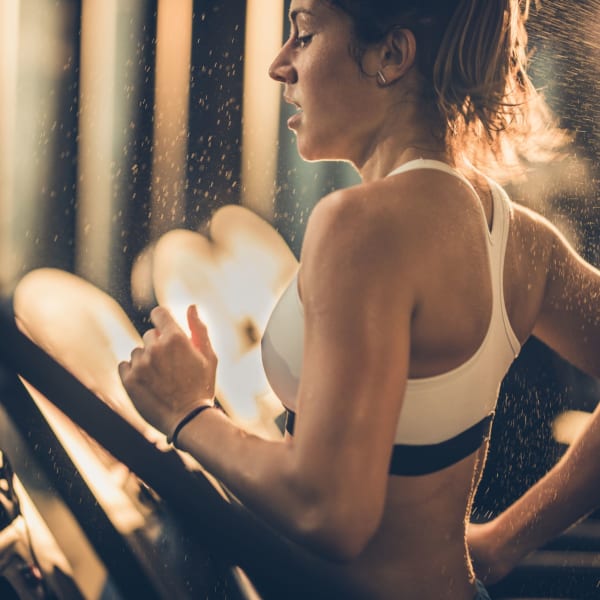 Woman staying in shape in the state of the art fitness center at Sanctuary on 51st in Laveen, Arizona