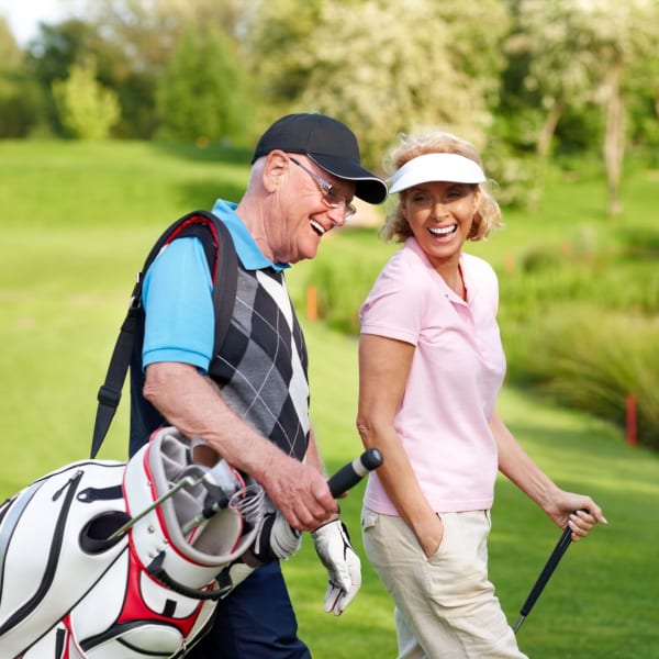 Residents golfing near The Atrium at Carmichael in Carmichael, California