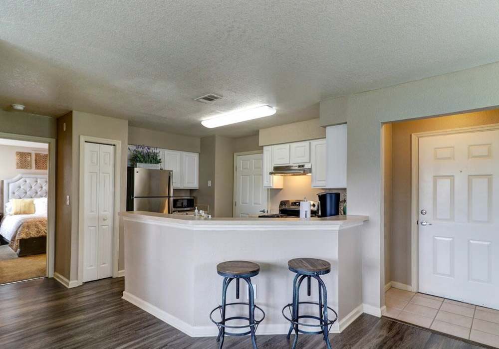 Kitchen with raised countertop and barstool at The Reserve at Kanapaha in Gainesville, Florida