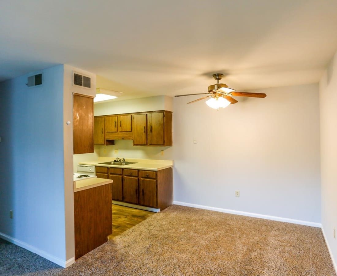 An apartment kitchen and living room at Meadowbrook and Brookridge in Charlotte, North Carolina