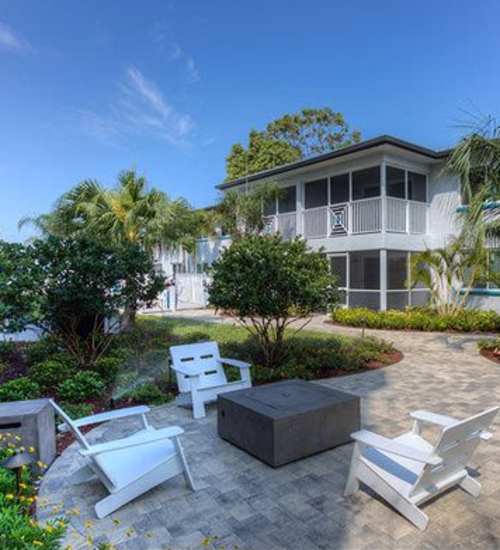 Outside firepit with seating area at Bayside Villa Apartments in South Pasadena, Florida  