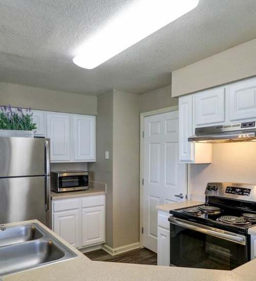 Kitchen with granite countertop at The Reserve at Kanapaha in Gainesville, Florida