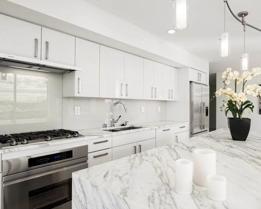 Kitchen with granite counters at The Wave at Stadium Place in Seattle, Washington