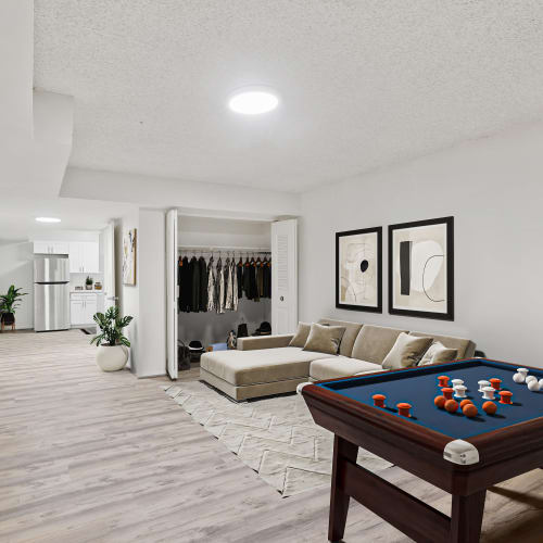 Model living room with a large area rug at Vistas of Annandale in Annandale, Virginia