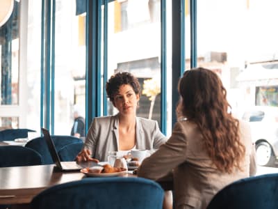 Residents having coffee and working at a cafe near Anatole at the Pines in Conroe, Texas