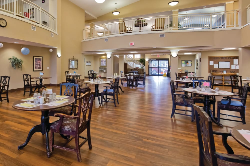 Large dining hall with hardwood floors at Meadowlark Senior Living in Lebanon, Oregon