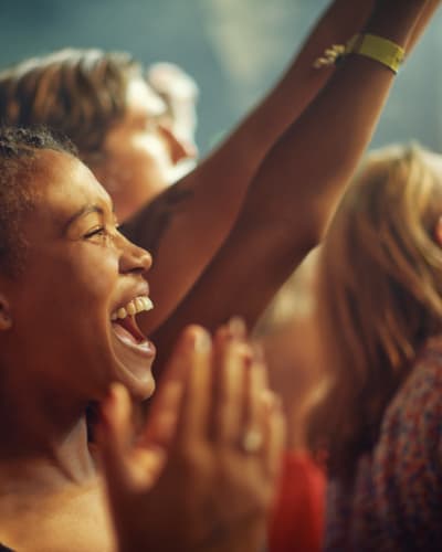 Resident friends at a concert at WAMU Theater near Vantage Park Apartments in Seattle, Washington