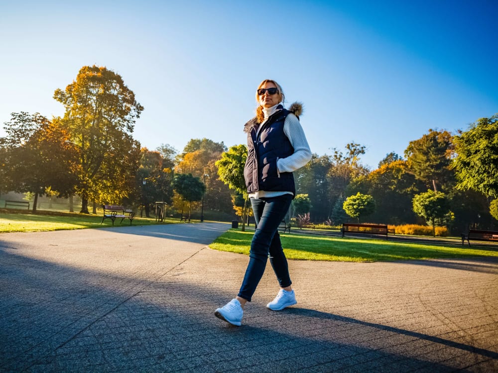 Resident taking a stroll through the neighborhood at Ardenwood in North Haven, Connecticut