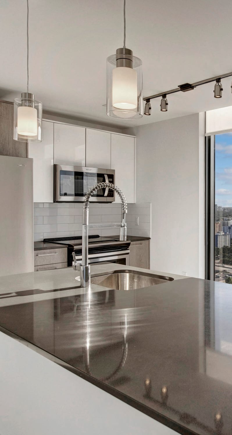 large kitchen with modern appliances at ParkLine Miami in Miami, Florida