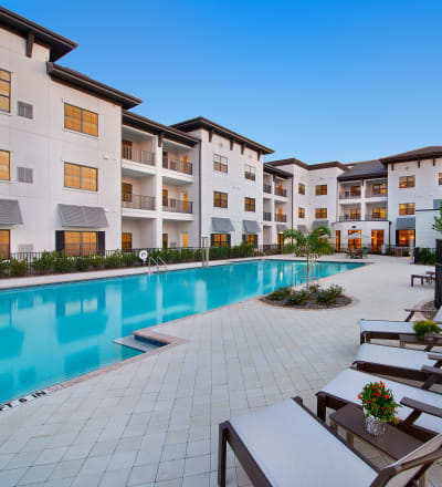 Outdoor poolside seating at Keystone Place at Four Mile Cove in Cape Coral, Florida