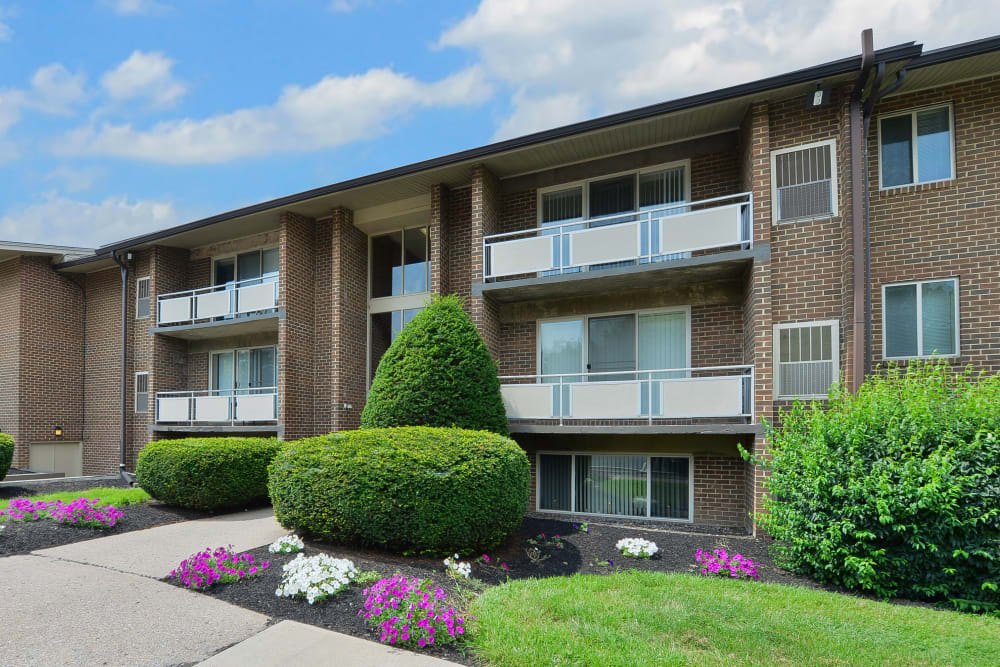 Building exterior with meticulous landscaping at Briarwood Apartments & Townhomes in State College, Pennsylvania