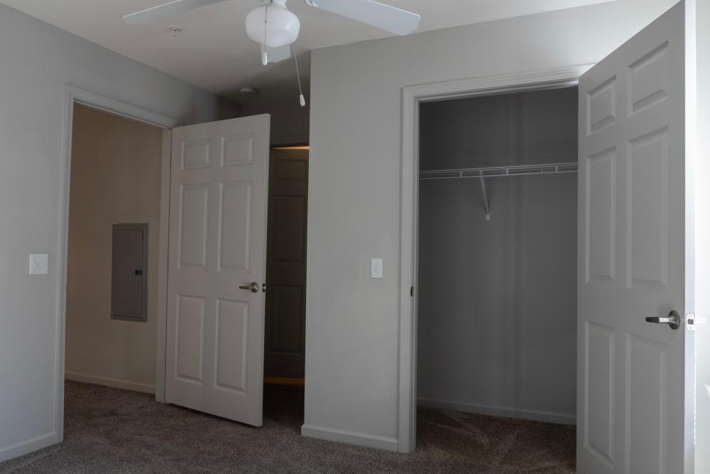Apartment bedroom with spacious closets at Redland Creek in Lawrenceville, Georgia