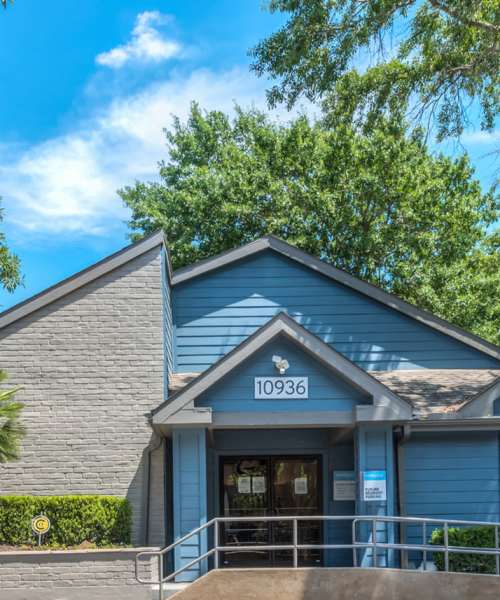 Property exterior with parking in the front at Warwick at Westchase in Houston, Texas