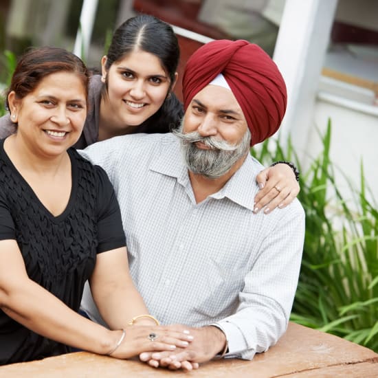 A family pose for a picture at Carefield Castro Valley in Castro Valley, California