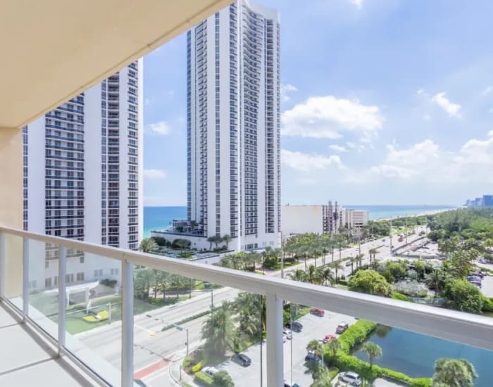 An ocean view from an apartment balcony at Marina Del Mar in Sunny Isles Beach, Florida